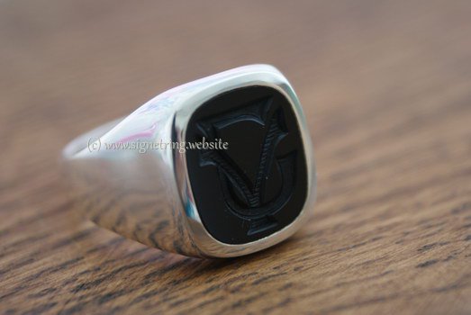 Silver ring with onyx engraving